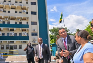 Prime Minister, Dr. the Most Hon. Andrew Holness (second right), is in discussion with Pastor Alicia Magnus, grandniece of former Prime Minister, the Most Hon. Portia Simpson Miller. Occasion was Tuesday