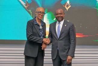 Minister of Finance and the Public Service, Hon Fayval Williams, shakes hands with Group Managing Director for Client Relations and Regional Operations at the African Export-Import Bank (Afreximbank), Eric Monchu Intong, during the Afreximbank Jamaica Roadshow at the AC Hotel by Marriott Kingston on Tuesday (June 2). The event was held under the theme ‘Empowering Jamaica’s Growth: Catalysing Trade, Investment, and Industrialisation through Tailored Afreximbank Solutions’.