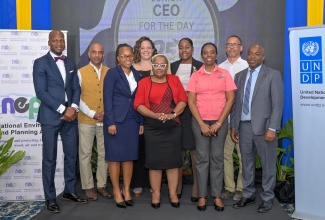 Chief Executive Officer (CEO) of the National Environment and Planning Agency (NEPA), Leonard Francis (right), joins stakeholder partners of the Junior CEO for a Day programme to symbolise the official launch of the initiative on Friday (June 5). The launch was held during NEPA’s 25th Anniversary Distinguished Lecture at the Jamaica Pegasus Hotel in New Kingston, under the theme: 'Recover Stronger, Recover Greener: Integrating Ecosystem Solutions in Post-Disaster Planning'. Participating in the ceremony are (from left) Permanent Secretary in the Ministry of Water, Environment and Climate Change, Wayne Robertson; United Nations Development Programme (UNDP) Resident Representative, Dr. Kishan Khoday; Senior Director of the National Development Planning, Policy and Monitoring Branch in the Ministry of Economic Growth and Infrastructure Development, Andrine McLaren; Association of Science Teachers of Jamaica (ASTJ) Representative, Dr. Debbie Devonish; Deputy Chief Education Officer in the Ministry of Education, Skills, Youth and Information, Dr. Winnie Berry; ASTJ Representative, Kadesha Croney; NEPA’s Public Education and Corporate Communications Branch Manager, Angela Hamilton; and Chairman of the Natural Resources Conservation Authority, Christopher Whyms-Stone.