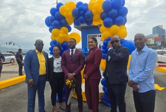 Chairman of the St. James Municipal Corporation and Mayor of Montego Bay, Councillor Richard Vernon (third left), shares a photo opportunity with stakeholders at the Harbour Street Automated Car Park on June 11. He is joined by (from left) Councillor for the Montego Bay South Eastern Division, Arthur Lynch; St James Municipal Corporation Director of Revenue and Commercial Services, Shanice Williams, and Chief Executive Officer, Naudia Crosskill; Deputy Mayor, Councillor Dwight Crawford, and Innovative Core Solutions Project Lead, Nicholas Thompson.
