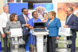 State Minister in the Ministry of Health and Wellness, Hon. Krystal Lee (second right) converses with stakeholders at the handover ceremony for 13 Cardiotocography (CTG) machines and one state-of-the-art ultrasound machine at Victoria Jubilee Hospital in Kingston on Monday (June 15). The items, valued at $32 million were donated by the Church of Jesus Christ of Latter-Day Saints and facilitated by the Food For the Poor Jamaica. Sharing in the occasion (from left) are Missionary for Church of Jesus Christ of Latter-Day Saints, Elder Paul Sutherland; Food For the Poor Jamaica Board Director, Jean Lowrie-Chin; Victoria Jubilee Hospital Senior Medical Officer, Dr. Garth McDonald; Deputy Director of Nursing Services at Bustamante Hospital for Children, Elise Fairweather-Blackwood; Executive Director of Food For The Poor (FFTP) Jamaica, Denise Cagley-Jefferson,and Caribbean Area Presidency at the Church of Jesus Christ of Latter-Day Saints, Elder Ahmad Corbitt.
