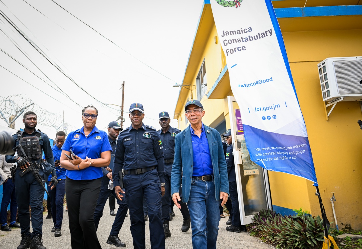 Deputy Prime Minister and Minister of National Security and Peace, Hon. Dr. Horace Chang (right), is joined by Permanent Secretary in the Ministry, Ambassador Alison Stone Roofe, and Police Commissioner, Dr. Kevin Blake, during a visit to the Area 5 Police Headquarters at the Constant Spring Police Station in St. Andrew on Thursday (June 4).
