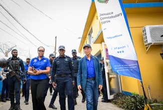 Deputy Prime Minister and Minister of National Security and Peace, Hon. Dr. Horace Chang (right), is joined by Permanent Secretary in the Ministry, Ambassador Alison Stone Roofe, and Police Commissioner, Dr. Kevin Blake, during a visit to the Area 5 Police Headquarters at the Constant Spring Police Station in St. Andrew on Thursday (June 4).