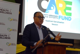 Minister of Health and Wellness, Dr. the Hon. Christopher Tufton, delivers remarks during the Community Arranged Response Efforts (CARE) Fund sensitisation session, held on June 24 at the Montego Bay Cultural Centre in St. James.
