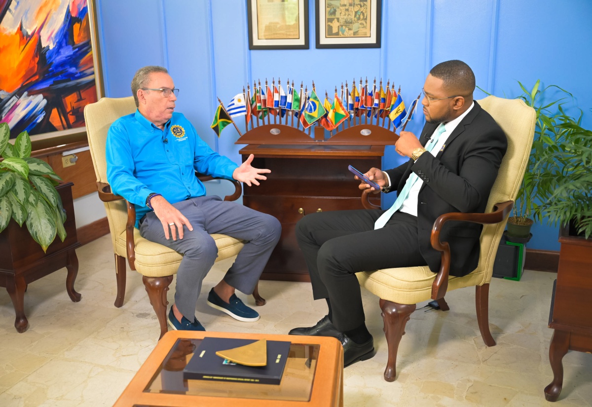 Minister of Energy, Transport and Telecommunications, Hon. Daryl Vaz (left), speaking during a Jamaica Information Service (JIS) Ministerial Update with JIS Chief Executive Officer, Giovanni Dennis, at the PCJ Building in Kingston on Thursday (June 11).
