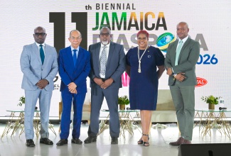 Deputy Prime Minister and Minister of National Security and Peace, Hon. Dr. Horace Chang (second left), shares a moment with (from left) Senior Communications Strategist at the Jamaica Constabulary Force, Senior Superintendent Dennis Brooks; Deputy Commissioner of Police, Jamaica Constabulary Force, Richard Stewart; Chief Technical Director, Crime Prevention, Ministry of National Security and Peace, Shauna Trowers; and Chief Cyber Security Expert, Major Organised Crime and Anti-Corruption Agency (MOCA), Dr. Patrick Linton, during the 11th Biennial Jamaica Diaspora Conference at the Montego Bay Convention Center in Rose Hall, St. James, on June 16.