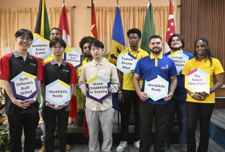Competitors preparing for the 48th WorldSkills Competition in Shanghai, China, share a photo opportunity during Monday’s (June 8) opening ceremony for the WorldSkills Jamaica Invitational Training Camp, held at Cardiff Hotel & Spa in Runaway Bay, St. Ann. The competitors are representing Barbados, China, Jamaica, Singapore and Brazil.
