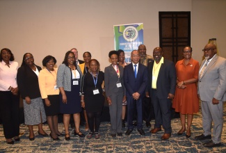 Minister of National Security and Peace, Hon. Dr. Horace Chang (fourth right), shares a photo opportunity with delegates from Jamaica and other Caribbean territories at the Caribbean Association of Forensic Sciences Biennial Conference on Monday (June 8), at The Jamaica Pegasus hotel in New Kingston. 
