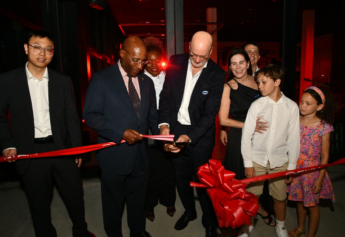 Minister of Industry, Investment and Commerce, Senator the Hon. Aubyn Hill (second left), and Managing Director, Stewart
