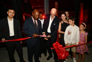 Minister of Industry, Investment and Commerce, Senator the Hon. Aubyn Hill (second left), and Managing Director, Stewart