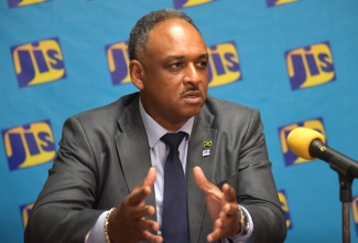 Managing Director of the Jamaica Social Investment Fund, Omar Sweeney, addresses a JIS Think Tank on June 16.
