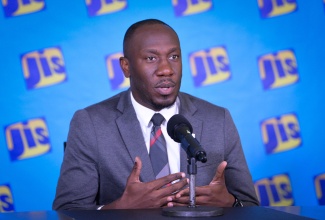 Assistant General Manager for Corporate Communications and Public Affairs at the National Housing Trust, Dwayne Berbick, speaks at JIS Think Tank on June 24 .
