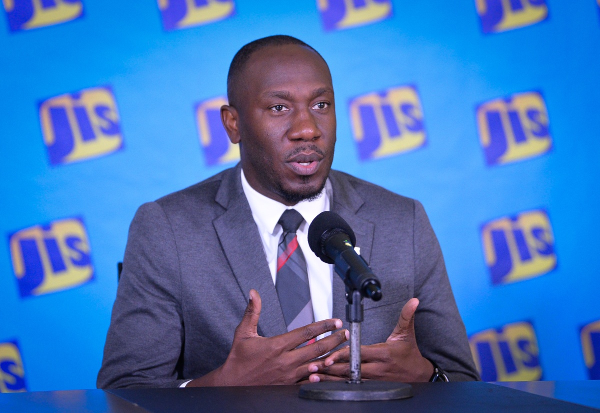 Assistant General Manager for Corporate Communications and Public Affairs at the National Housing Trust (NHT), Dwayne Berbick, addresses a Jamaica Information Service (JIS) 