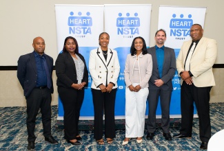 Managing Director of the HEART/NSTA Trust, Dr. Taneisha Ingleton (third right), shares a photo opportunity with stakeholders during the CARICOM Technical and Vocational Education and Training (TVET) Digitalisation Project Closing Summit on May 27, at The Jamaica Pegasus hotel in New Kingston. Pictured (from left) are Technical Officer, Caribbean Association of National Training Authorities (CANTA), Orlando Hewitt; Deputy Programme Manager, CARICOM Secretariat, Dr. Denise Stoney James; Vice Chair, HEART/NSTA Trust Board of Directors, Rayharna Wright; Project Technical Coordinator for GIZ–Deutsche Gesellschaft für Internationale Zusammenarbeit Brazil, João Paulo Freitas; and HEART/NSTA Trust Director of Training Infrastructure and Development, Dwayne Bent.
