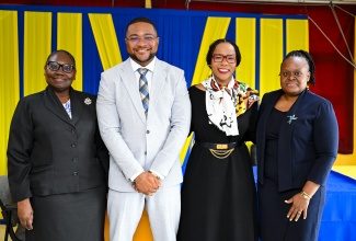 Newly appointed Chief Executive Officer (CEO) of the Jamaica Information Service (JIS), Giovanni Dennis (second left) shares a photo opportunity with Permanent Secretary in the Ministry of Education, Skills, Youth and Information, Dr. Kasan Troupe (second right); Deputy CEO, Celia Lindsay;  and Chief Technical Director (CTD) in the Information Division of the Ministry of Education, Skills, Youth and Information, Dr. Nicola-Ann Brown Pinnock. 

