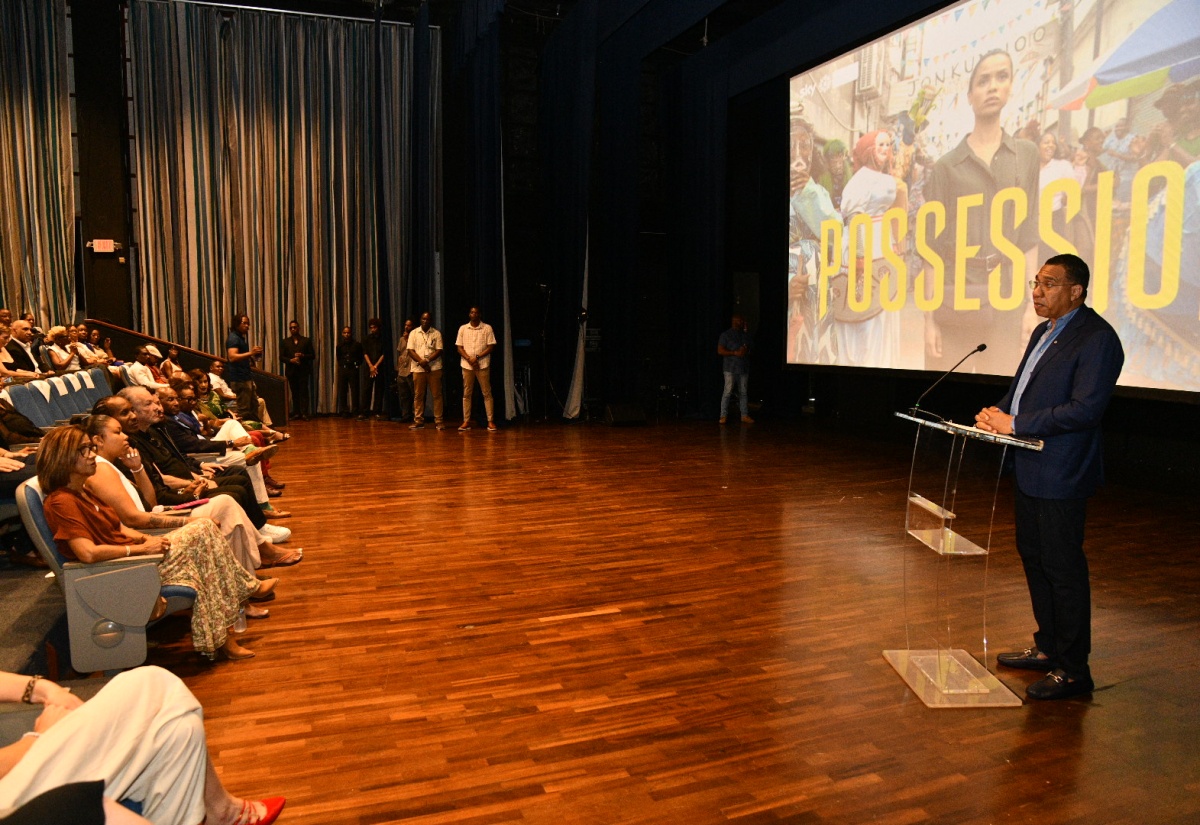 Prime Minister, Dr. the Most Hon. Andrew Holness (right), addresses the special Jamaican screening of Possession, a five-part supernatural thriller produced by Snowed-In Productions in association with Sky Studios, at the Courtleigh Auditorium in St. Andrew, on Saturday (June 20).
