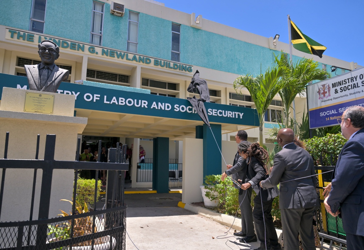 Prime Minister, Dr. the Most Hon. Andrew Holness (left), leads in the recent unveiling of the Ministry of Labour and Social Security's  Lynden G. Newland Building at 14 National Heroes Circle in Kingston, in tribute to the late former Minister of Labour and National Insurance, who spearheaded the passage of the National Insurance Act in 1966. The Prime Minister is joined by Mr. Newland’s grandnephew, Stephen Newland; Portfolio Minister, Hon. Pearnel Charles Jr.; and Leader of the Opposition, Mark Golding.
