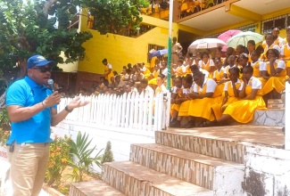 Regional Manager at SPM Waste Management Limited, Sheldon Smith (left), speaks to students at BB Coke High School in Junction, St. Elizabeth, following a recent road show hosted by the agency.