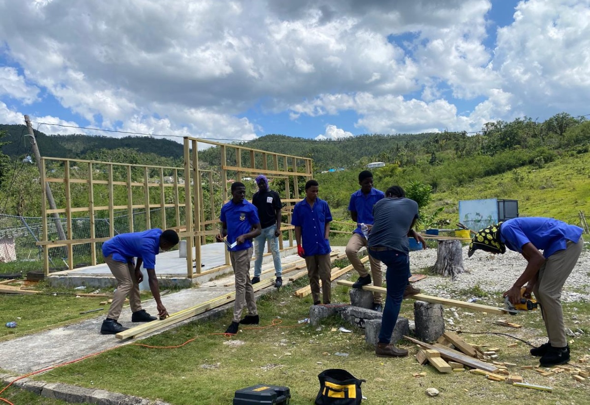 Students and staff of Aberdeen High School in St. Elizabeth joined forces to rebuild the institution’s tuck shop, which was destroyed by Hurricane Melissa.
