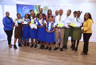 Chief Executive Officer of the Social Development Commission, Omar Frith (back row, second left), shares a moment with key stakeholders and students at the Hanover Youth Entrepreneurship awards ceremony, at S Hotel in Montego Bay, St. James, on Friday (July 3).
