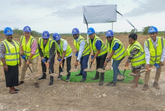 Minister of Agriculture, Fisheries and Mining, Hon. Floyd Green (fourth right), is joined by other agricultural stakeholders in the ground-breaking exercise to signify the launch of the Hartlands Irrigation Project in St. Catherine on Tuesday (July 21). He is joined by (from left) Hartlands farmer, Tanya Anderson; Chief Executive Officer (CEO) of the Agro-Investment Corporation (AIC), Vivion Scully;  Board Chairman of the Sugar Company of Jamaica Holdings (SCJH) Limited, Cleveland Allen; Board Chairman of the National Irrigation Commission (NIC), Vitus Evans; Minister without Portfolio in the Office of the Prime Minister with responsibility for Science, Technology and Special Projects and Member of Parliament for St. Catherine South Central, Dr. the Hon. Andrew Wheatley; Chief Executive Officer (CEO) of the National Irrigation Commission (NIC) Joseph Gyles; Councillor for Horizon Park Division, Jennifer Hull and Managing Director of SCJH, Nigel Myrie. The mini pressurised irrigation system is expected to benefit 41 farmers in Hartlands during its immediate implementation, with plans to expand the system up to 400 acres.
