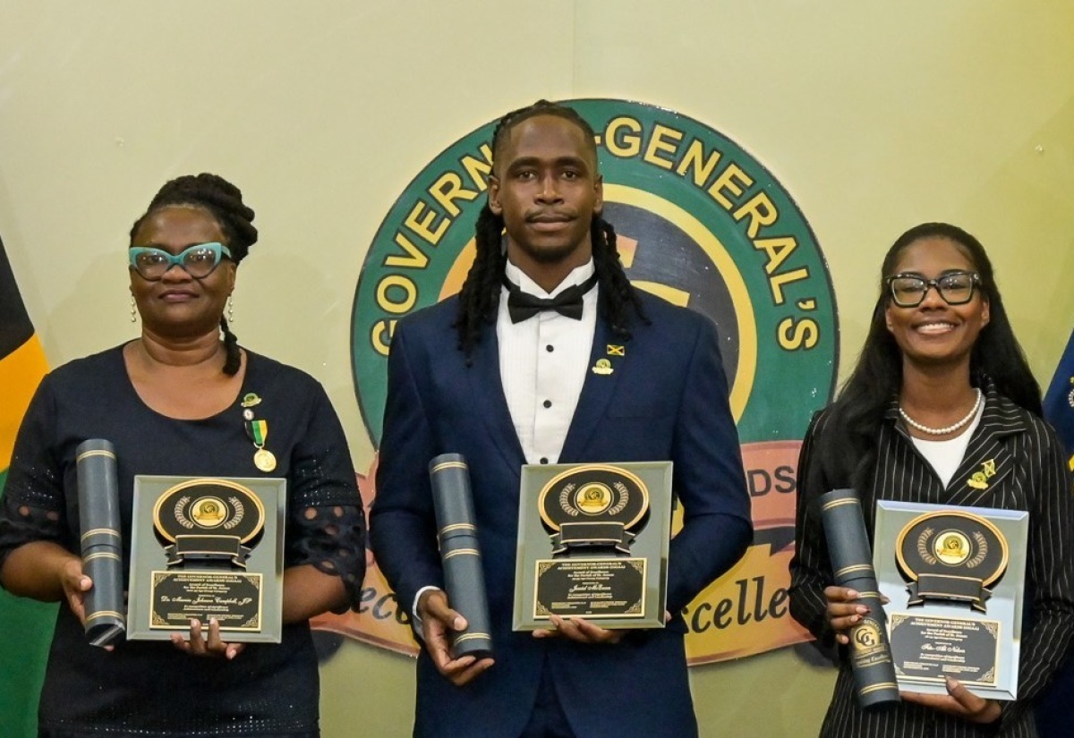 2026 Governor-General’s Achievement Award recipient for St. James, in the 25-35 age category, Janiel McEwan (centre) shares a photo with fellow St. James awardees Dr. Marcia Johnson Campbell (left), over 35 age category, and Fitz-Ali Brianne Nelson (18-24 age category), during the awards ceremony at King’s House on July 2, 2026.
