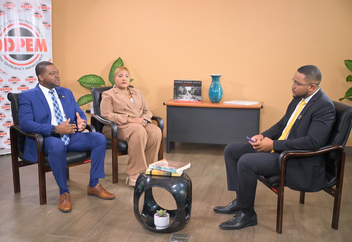 Director General at the Office of Disaster Preparedness and Emergency Management (ODPEM), Commander Alvin Gayle (left), and ODPEM’s newly appointed Board Chairman, Trudy Deans (centre), respond to questions during a Special Interview with JIS Chief Executive Officer (CEO), Giovanni Dennis, at ODPEM’s offices on Tuesday (July 21).
