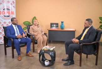 Director General at the Office of Disaster Preparedness and Emergency Management (ODPEM), Commander Alvin Gayle (left), and ODPEM’s newly appointed Board Chairman, Trudy Deans (centre), respond to questions during a Special Interview with JIS Chief Executive Officer (CEO), Giovanni Dennis, at ODPEM’s offices on Tuesday (July 21).
