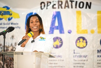 Operations Director at the National Solid Waste Management Authority (NSWMA), Aretha McFarlane, addresses the recent launch of Operation CALM (Cleaning, Advising, Leveraging and Maintaining) at the Hugh Shearer Community Centre in Rocky Point, Clarendon.

