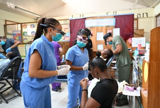 Dentists provide care to patients during a free medical and dental mission spearheaded by faith-based non-profit organisation Zion Care International, at Tacky High School in Gayle, St. Mary. The outreach, held from July 20 to 24, delivered free medical and dental services to residents of Gayle and surrounding communities.
