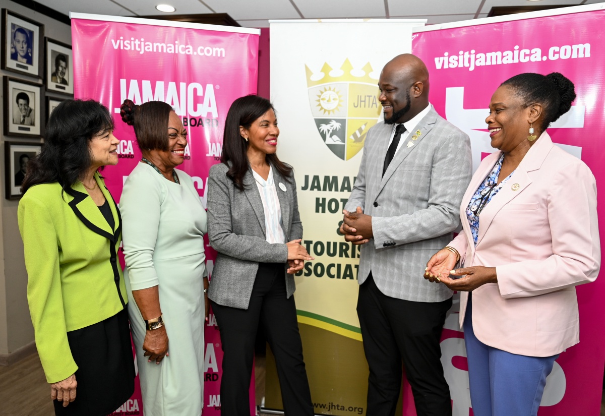 Jamaica Product Exchange (JAPEX) Chair, Nicola Madden-Greig (centre), engages in discussion with Jamaica Hotel and Tourist Association (JHTA) President, O’Brian Heron, and other tourism stakeholders during the launch of JAPEX 2026 on Monday (August 10) at the Jamaica Tourist Board (JTB) headquarters in New Kingston. Also participating in the conversation are (from left) JHTA Executive Director, Camille Needham; JHTA Ocho Rios Chapter Chair, Vana Taylor; and Permanent Secretary in the Ministry of Tourism, Jennifer Griffith.
