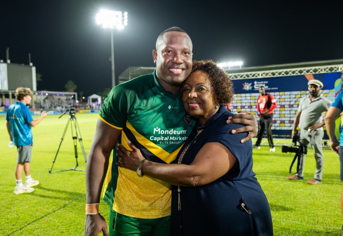 Minister of Culture, Gender, Entertainment and Sport, Hon. Olivia Grange, poses for a photograph with Jamaican cricketer, Rovman Powell, during Jamaica's final home match of the 2026 Caribbean Premier League (CPL) season between the Jamaica Kingsmen and the St. Kitts and Nevis Patriots at Sabina Park in Kingston on August 18.
