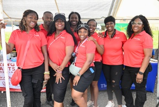 Managing Director of the Karing Hearts Foundation, Kayann Wallace (third right, back row), and Kemone Brown (second left, back row), pose with fellow Foundation members during the organisation’s annual Health Fair and Back-to-School Treat at Font Hill Primary School in St. Thomas on August 14. Also pictured (from left) are Dion Wallace, Dwight Hall, Cheryl Hall, Diana Peterkin, Charlene Miller and Nadine Hines.
