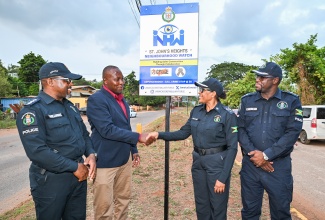 President of the St. John’s Heights Citizens Association in St. Catherine, Yian Shettlewood (second left), greets Head of the Jamaica Constabulary Force (JCF) Community Safety and Security Branch, Assistant Commissioner of Police (ACP) Charmaine Shand, during the launch of the St. John’s Heights Neighbourhood Watch in St. Catherine on Sunday (August 23). Looking on (from left) are Territorial Officer in the St. Catherine North Police Division, Inspector Ishmael Williams, and Commanding Officer, Senior Superintendent of Police (SSP) Hopton Nicholson.

