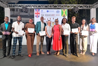 Minister of Foreign Affairs and Foreign Trade, Senator the Hon. Kamina Johson Smith (fifth left), and British High Commissioner to Jamaica, Alicia Herbert (fifth right) share a moment with Chevening, Commonwealth and Queen Elizabeth II Commonwealth Trust scholars (from left) Nicholas Kee, Jerome Garwood, Emoney Clayton, Ricardo Hunter, Lamar-Shey Grant, Akeem Campbell, Melisha Gordon and Zantaye Thomas inside the Windrush Gardens on the grounds of the British High Commission in Kingston, Jamaica, on Tuesday (August 25). The occasion was a send-off ceremony held in honour of the scholars.
