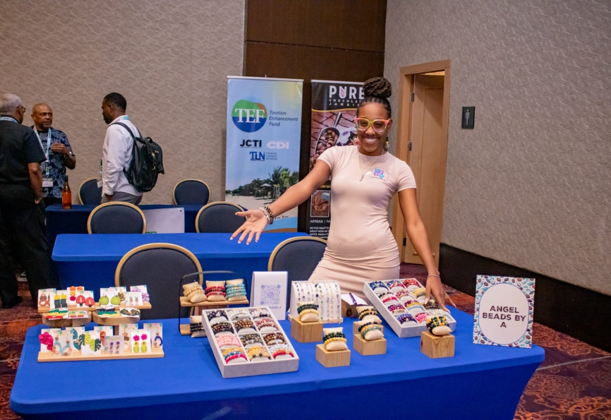 Co-owner of Angel Beads by A, Dadriel Bent, shows off her products on the trade floor at the 36th staging of the Jamaica Product Exchange (JAPEX), held recently in Ocho Rios, St. Ann.
