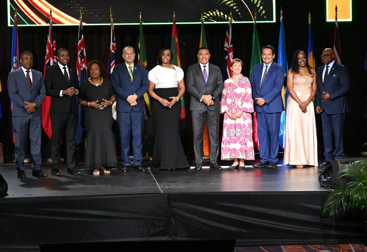Prime Minister, Dr. the Most Hon. Andrew Holness (fifth right), joins local officials for an official group photograph during the 48th Regional Conference of the Commonwealth Parliamentary Association (CPA) Caribbean, Americas and Atlantic (CAA) Region at Moon Palace Jamaica in St. Ann on Monday (August 31). They include (from left) Leader of Opposition Business in the House of Representatives, Phillip Paulwell; Minister without Portfolio in the Ministry of Economic Growth and Infrastructure Development with responsibility for Works, Hon. Robert Morgan; Minister of Culture, Gender, Entertainment and Sport, Hon. Olivia Grange; President of the Senate, Senator the Hon. Thomas Tavares-Finson; Speaker of the House of Representatives and Chair of the CPA Caribbean, Americas and Atlantic (CAA) Region, the Most Hon. Juliet Holness; Minister of Tourism, Hon. Edmund Bartlett (right); and other dignitaries.
