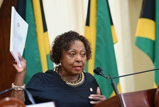 Minister of Culture, Gender, Entertainment and Sport, Hon. Olivia Grange, displays a copy of Jamaica’s reparations petition during a post-Cabinet press briefing on Wednesday (September 23) at Jamaica House.

