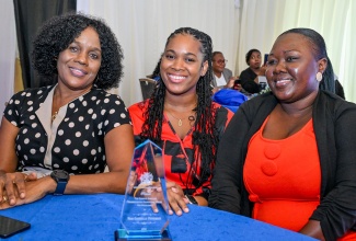 Ministry of Labour and Social Security Secretary of the Year for 2025-26 and inaugural recipient of the Camille Sinclair Secretary’s Award, Gabrielle Patterson (centre), shares a photo with Director of the Industrial Disputes Tribunal (IDT), Maureen Kennedy (left), and fellow secretary, Nalecha Johnson Hudson, during the presentation ceremony at the Terra Nova All Suite Hotel in St. Andrew on Wednesday (September 9).
