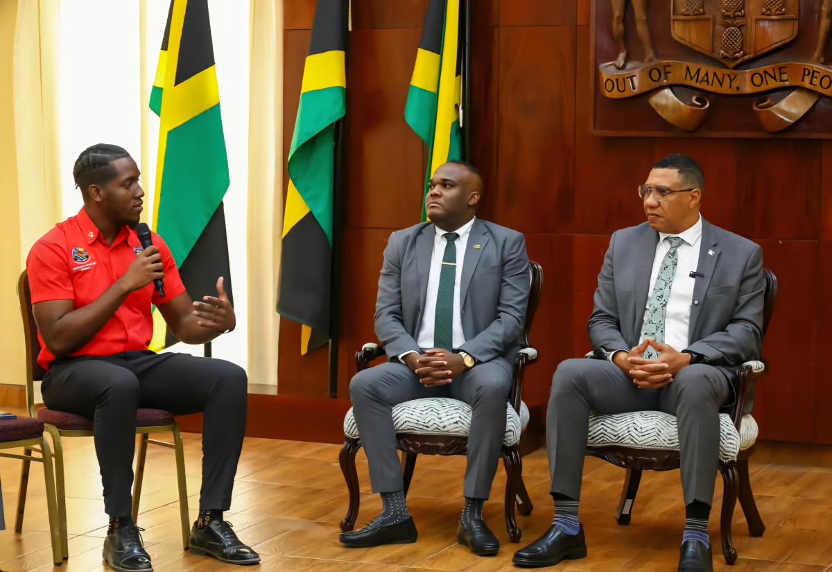 Prime Minister, Dr. the Most Hon. Andrew Holness (right), and Minister of State in the Office of the Prime Minister, Senator the Hon. Abka Fitz-Henley (centre), listen to remarks by University of the West Indies (UWI) Mona Guild President, Keshawn McGrath, during a courtesy call at Jamaica House on September 18.
