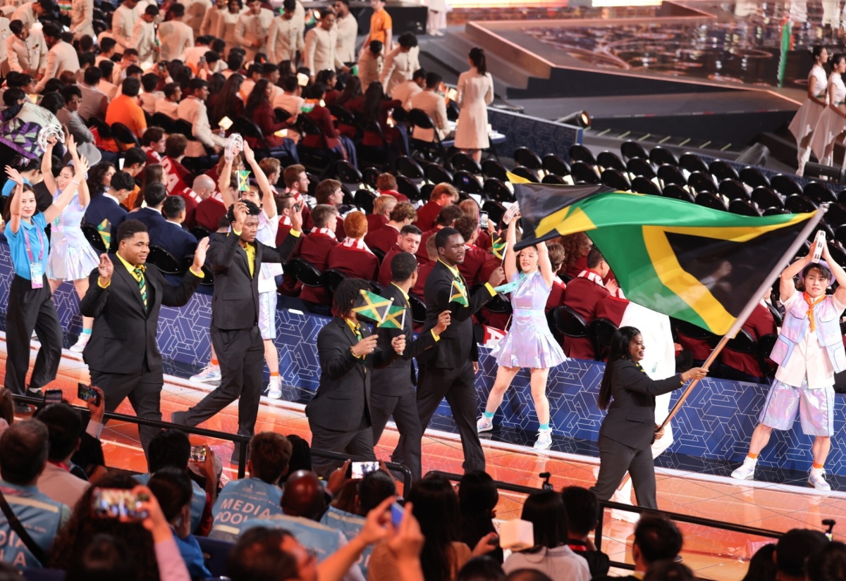 Team WorldSkills Jamaica makes their entry during the parade of teams at Tuesday's (September 22) WorldSkills Shanghai 2026 opening ceremony, held at Shanghai World Expo Cultural Center in Shanghai, China. Bearing the flag is Manager of WorldSkills Jamaica, Makeda Ramgeet Baugh.
