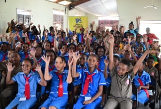Students from the Trinity Preparatory School in Linstead, St. Catherine, participate in an activity during the Jamaica Information Service (JIS) Heritage School Tour stop at the school on September 30. The Heritage Tour is an annual activity, where a team from the JIS journeys to selected schools across all parishes to share essential nuggets on Jamaican history and heritage, while interacting with students and exploring their talents through cultural presentations. 
