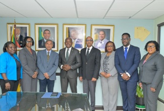 Minister of Labour and Social Security, Hon. Pearnel Charles Jr. (fourth left), is joined by Acting Permanent Secretary, Dione Jennings (second left), and some key officials from the Ministry in welcoming newly appointed United Nations Children's Fund (UNICEF) Representative for Jamaica, Osama Makkawi Khogali (fourth right) and his team, during a courtesy call at the Ministry’s 1F North Street location in Kingston on Tuesday (October 13). From left are Director of the Early Stimulation Programme (ESP), Dr. Antonica Gunter-Gayle; UNICEF Jamaica Deputy Representative, Mohammad Mohiuddin; Chief Technical Director of the Social Security Division at the Ministry, Audrey Deer-Williams; Social Policy Specialist and Social Protection Officer at UNICEF Jamaica, Andre Miller, and Acting Executive Director, Jamaica Council for Persons with Disabilities (JCPD), Desreen Boothe.

