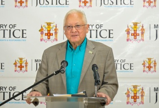 Minister of Justice and Constitutional Affairs, Hon. Delroy Chuck, addresses stakeholders during a press briefing on key justice matters at the Ministry’s office in St. Andrew on Friday (October 2).
