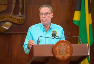 Energy, Transport and Telecommunications Minister, Hon. Daryl Vaz, addresses Wednesday’s (October 14) post-Cabinet press briefing at Jamaica House.
