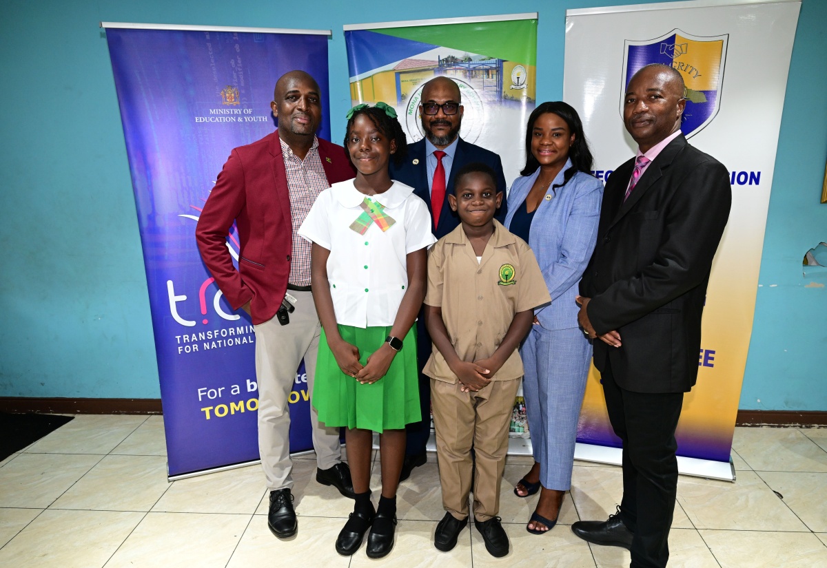 Back row: Principal of Mona Heights Primary School, Alex Hepburn; Executive Director of the Integrity Commission, Craig Beresford; Director of Corruption Prevention, Stakeholder Engagement and Anti-Corruption Strategy at the Integrity Commission, Sashein Wright-Chin; and Senior Education Officer in the Core Curriculum Unit of the Ministry of Education, Skills, Youth and Information, Marlon Williams, with Integrity Champions Shennoya Forrest and Daniel Saddler, following a visit to the school on Friday, September 22.

