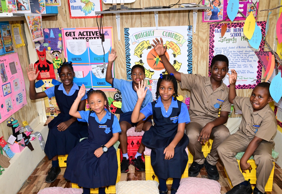 Students at McIntosh Memorial Primary School in Manchester proudly demonstrate their commitment to the values promoted through the institution's Integrity Corner initiative.

