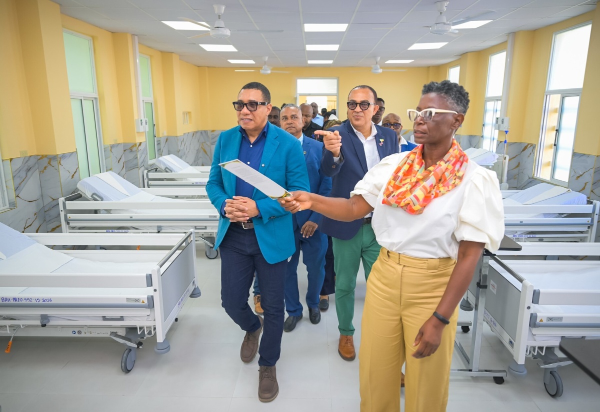 Prime Minister, Dr. the Most Hon. Andrew Holness (left), and Minister of Health and Wellness, Dr. the Hon. Christopher Tufton (second right), tour a ward in the rehabilitated Black River Hospital in St. Elizabeth, on Wednesday (October 28). Leading the tour is Chief Executive Officer at the facility, Diane Brown- Miller.  
