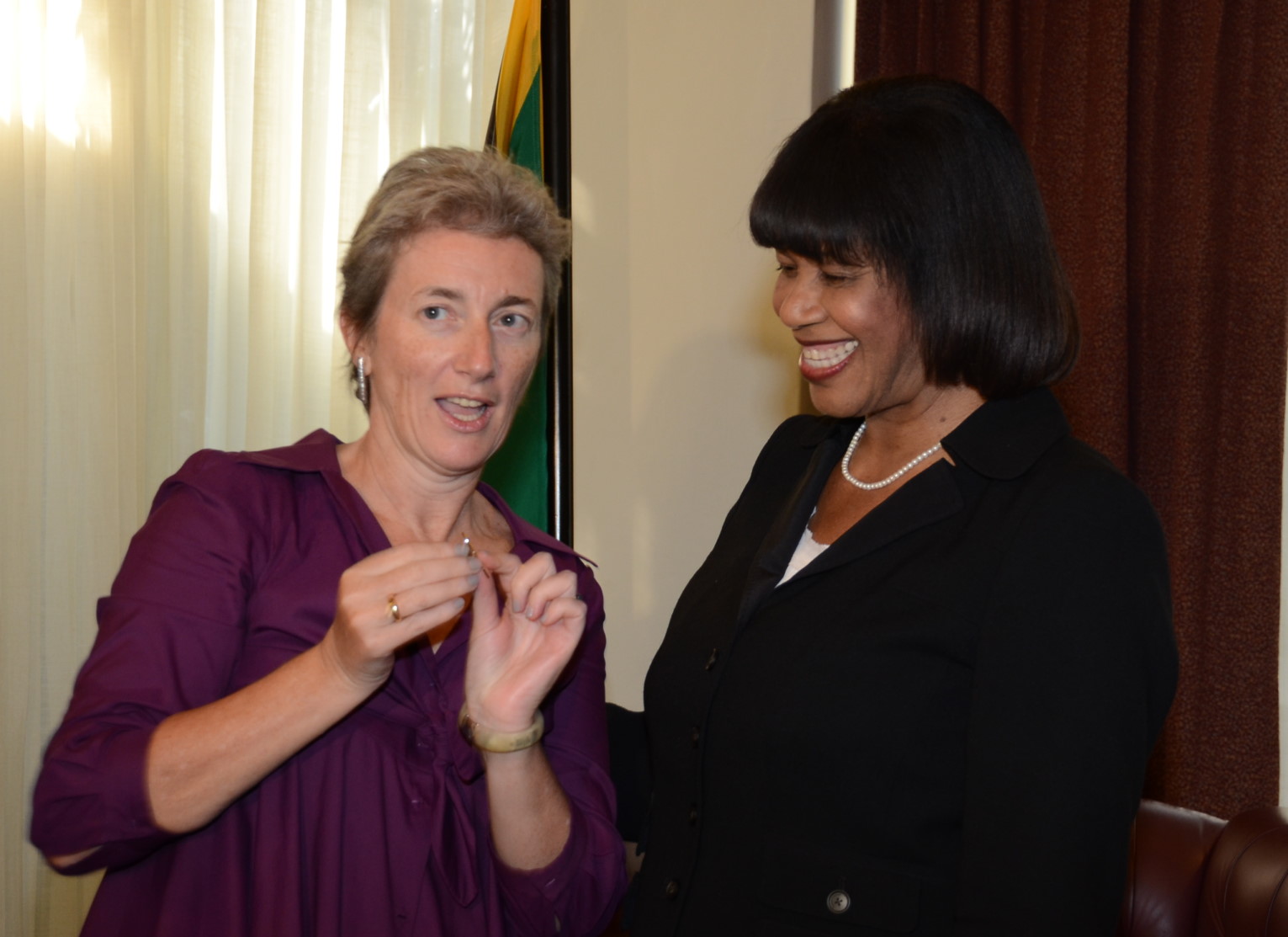 Prime Minister the Most Hon. Portia Simpson Miller in conversation with Head of Delegation for the European Union, Her Excellency Paola Amadei during a courtesy call (March 13) at the Office of the Prime Minister where Ambassador Amadei congratulated Jamaica for reducing the population of juveniles in State care. The Prime Minister in thanking the EU and UNICEF for providing technical and financial support to the Reducing Juvenile Population in State-supported Institutions Project proposed that increased interaction between children in State care and their parents and counseling for both parties be implemented as part of the project. 
