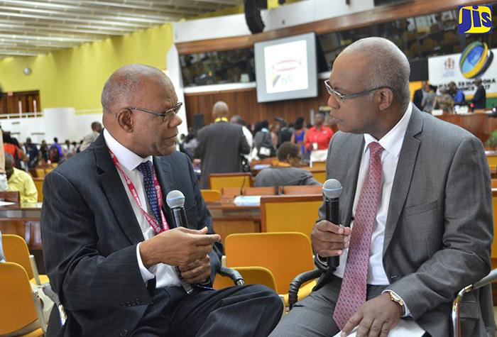 High Commissioner to the United Kingdom (UK), His Excellency Seth George Ramocan (left), speaking in an interview with the Jamaica Information Service’s (JIS) Ian Boyne on the second day of the Diaspora Conference, downtown Kingston, on July 25.
